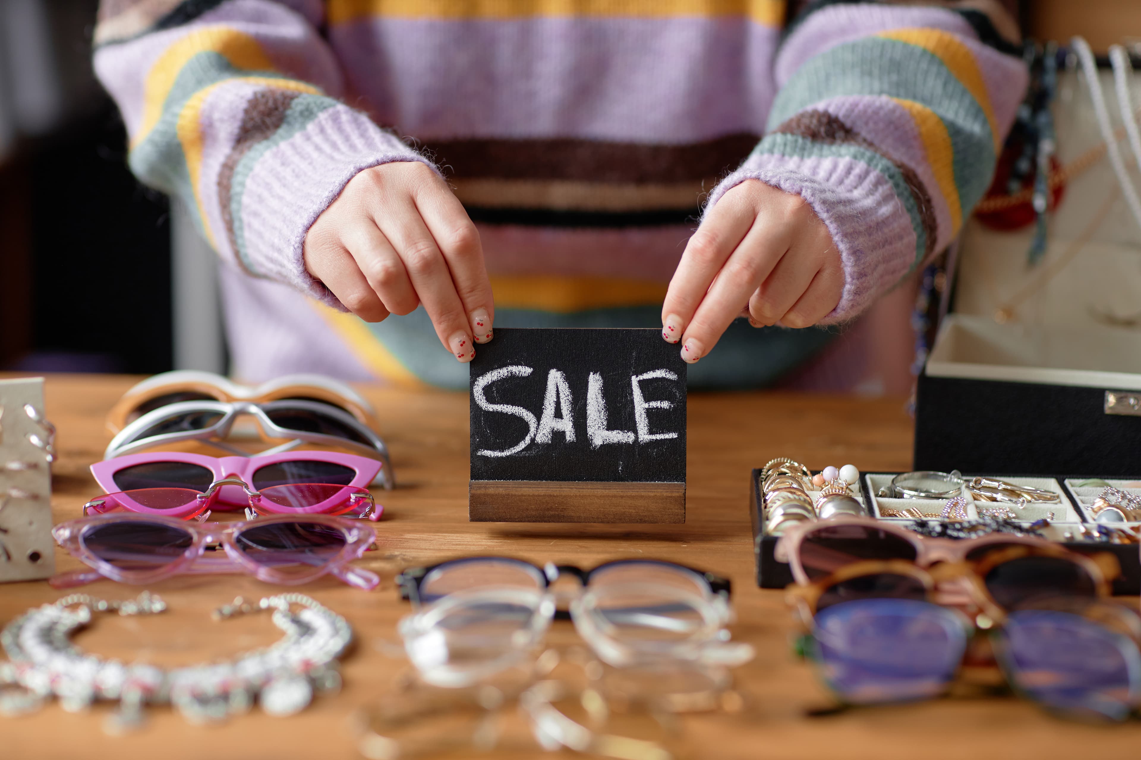 Estate sale display with a handwritten sale sign